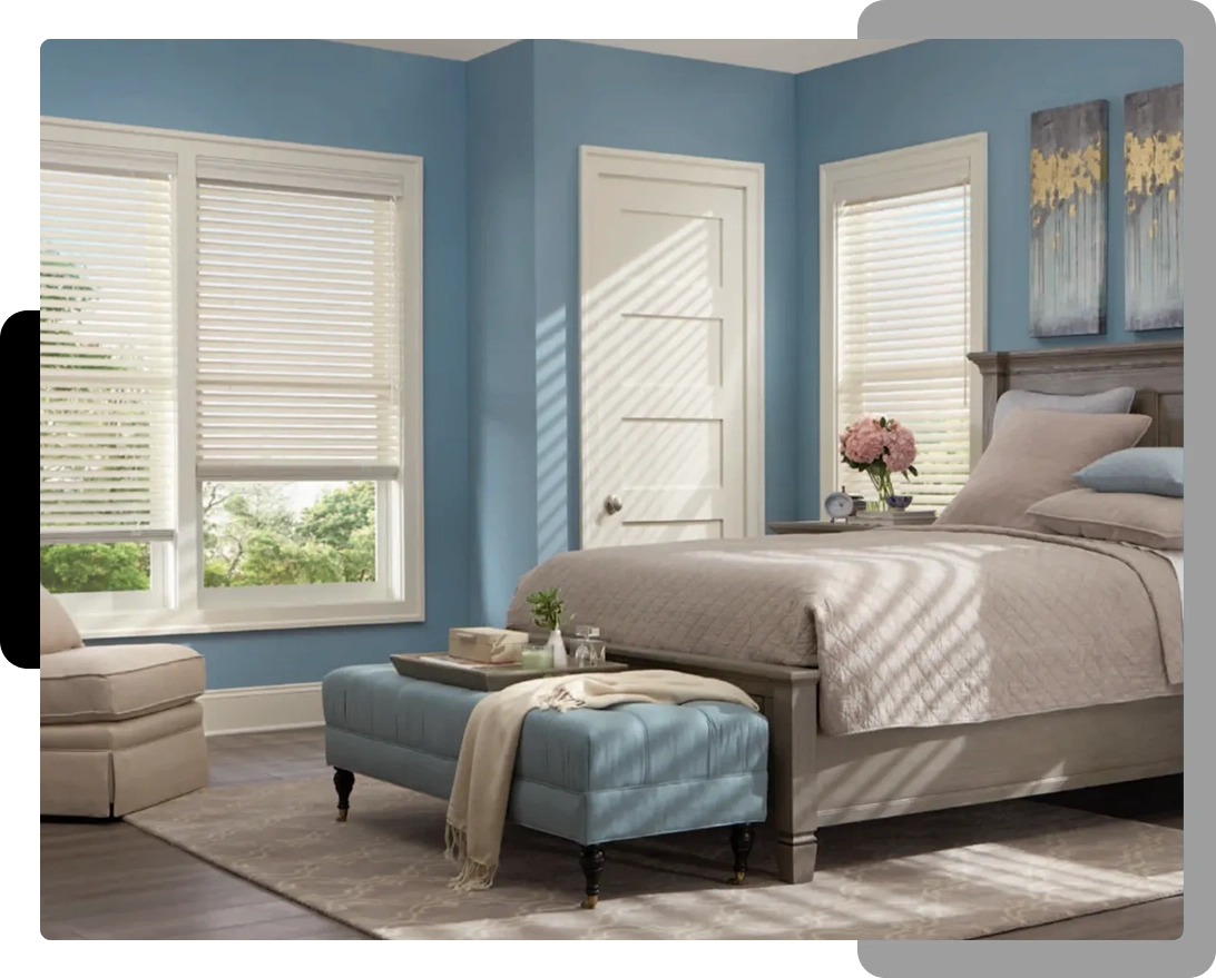 A bedroom with blue walls and white blinds.