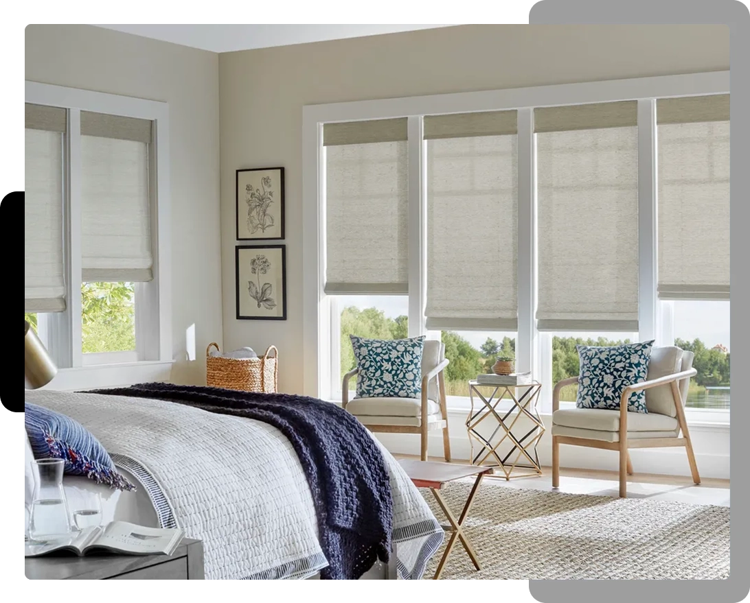 A bedroom with white walls and furniture.