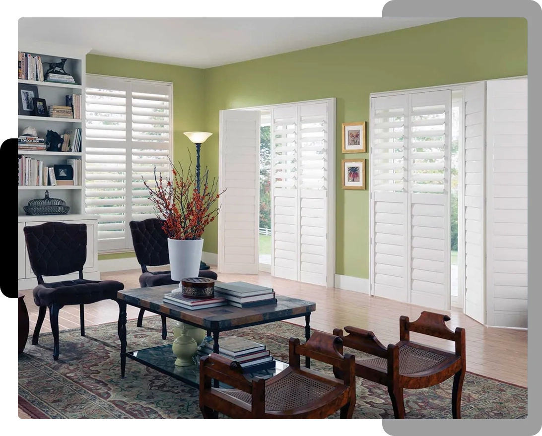 A living room with chairs and tables in it