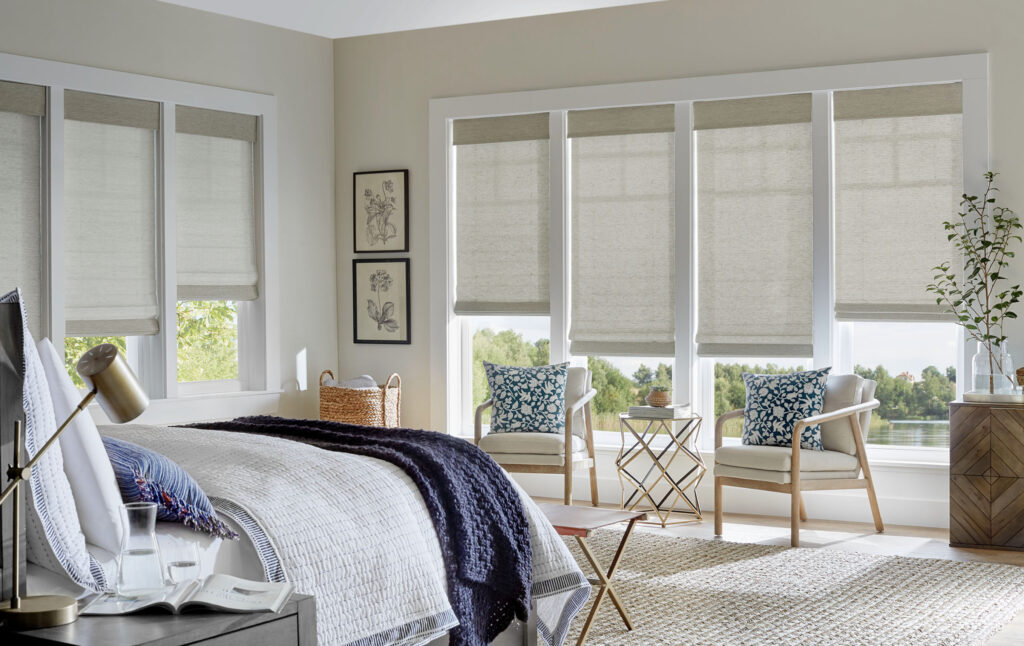 A bedroom with white walls and blue accents.